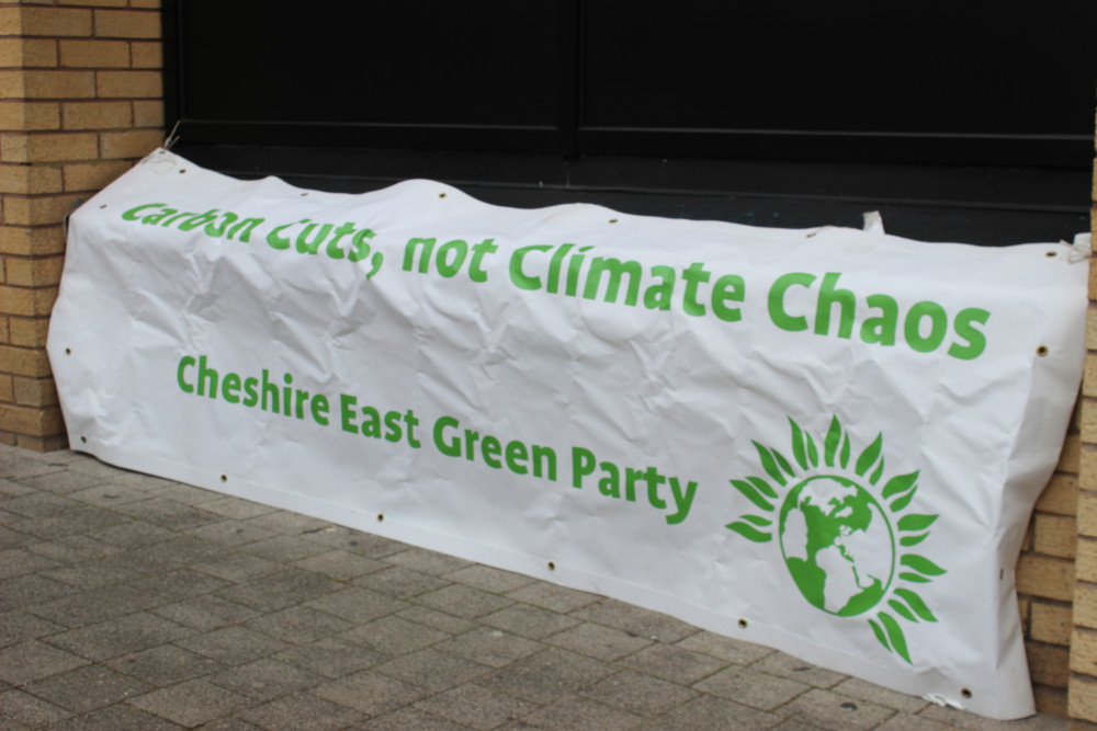 Sandbach: A Cheshire East Green Party banner at a Cheshire East Council meeting earlier this year. (Image - Alexander Greensmith / Sandbach Nub News)