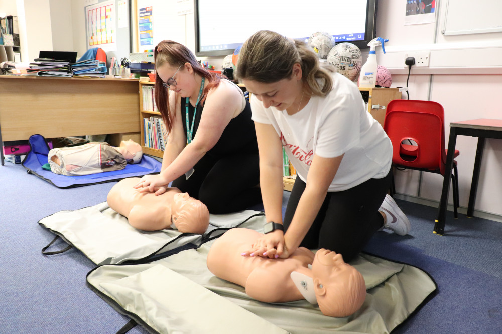 Students practising first aid