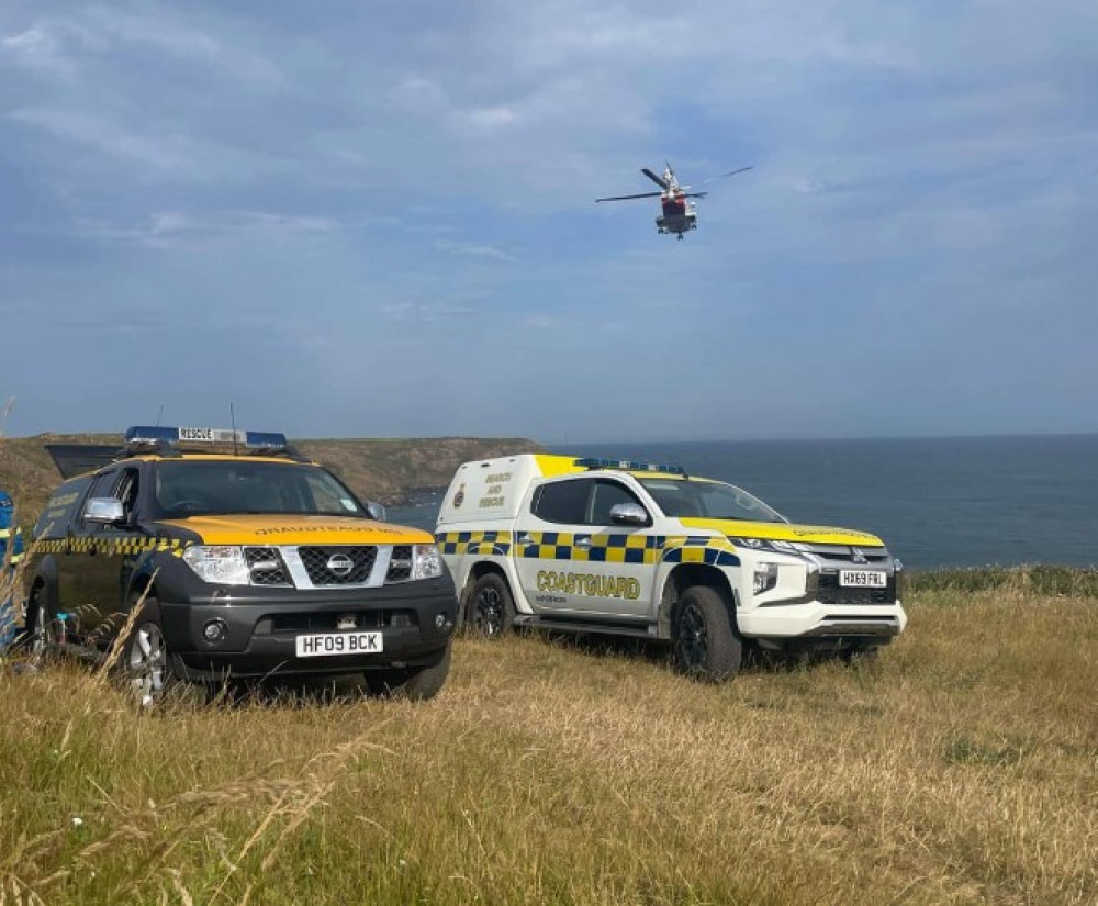 The helicopter from Newquay assists Porthoustock Coastguard Rescue Team.