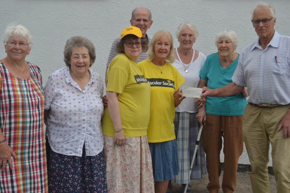 The group were thrilled to receive the donation from (right) Jim Dowling handing a cheque to Vera Ford