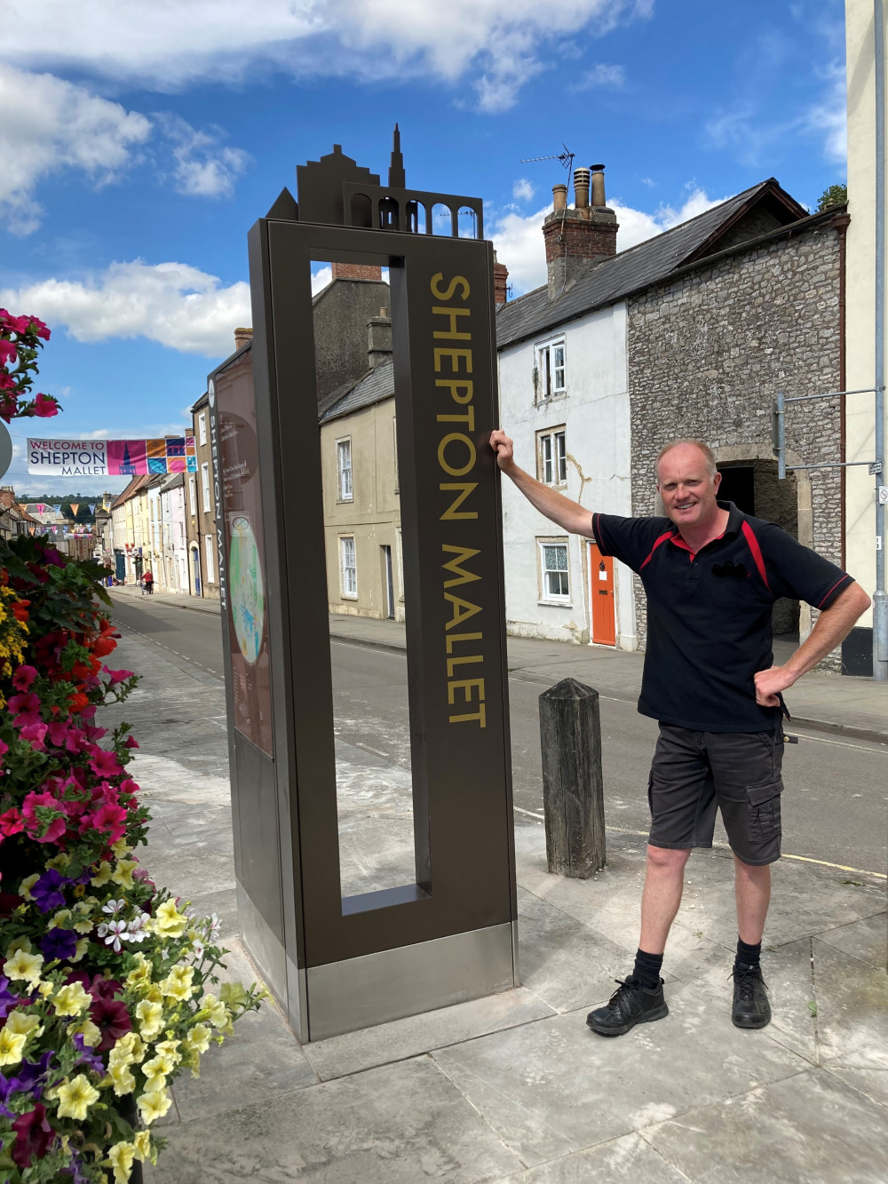 Cllr Matt Harrison with one of the new signs