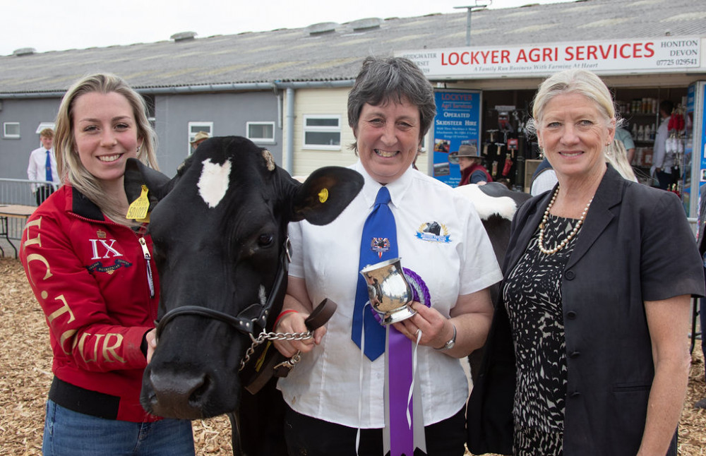 Carol Paris, Chief Executive of the Royal Bath & West Society (far right) pictured with Abby and Tracy Marshall, who recieved the Jubilee Award for most points in dairy competition at the Royal Bath and West Show this year