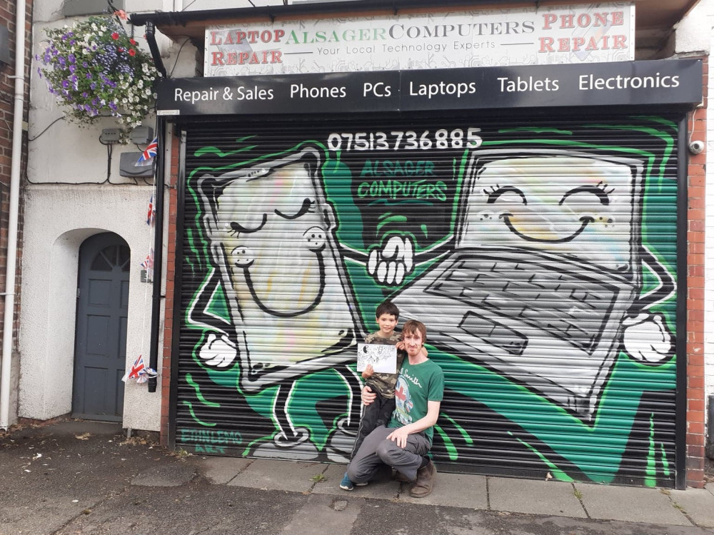 Richard with his son, Alex, in front of the "offending" shutter 