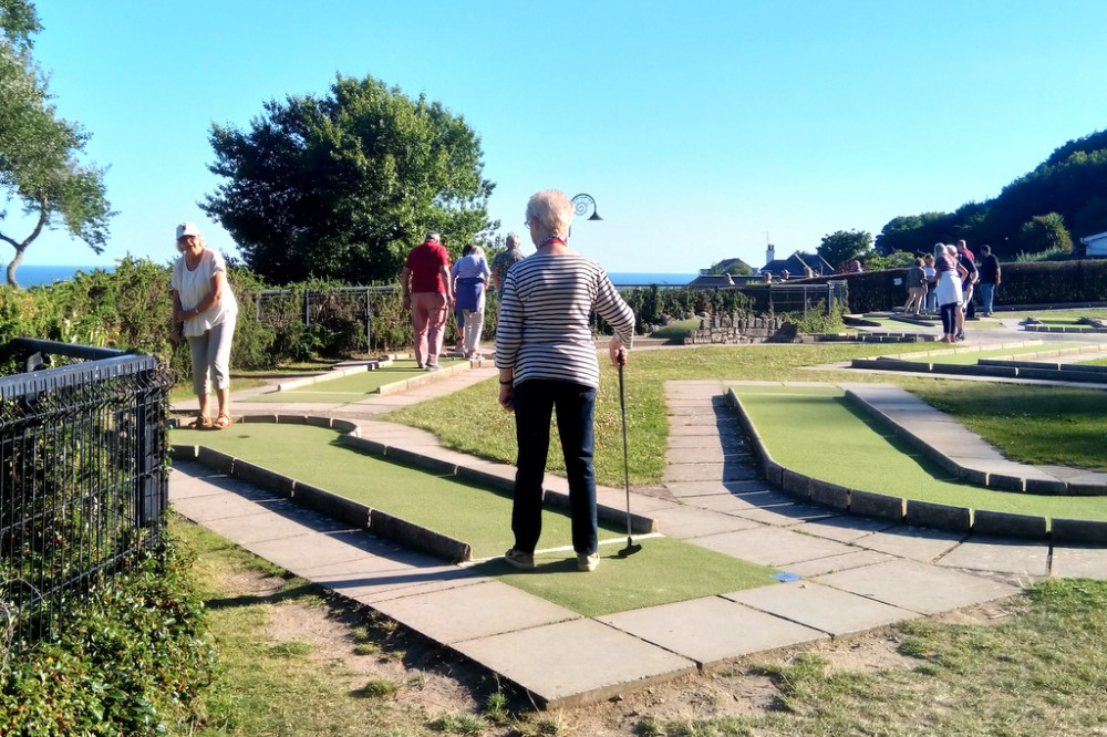 Members of Axminster Twinning Association enjoy mini golf in Lyme Regis