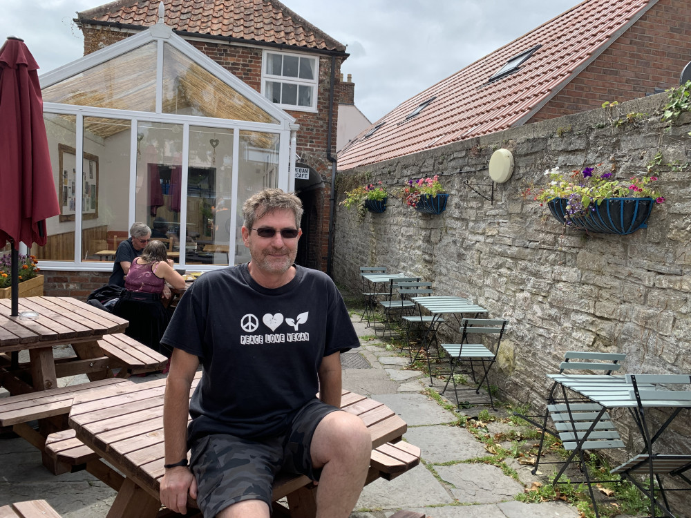 Matt Sparrey in the courtyard of the Pyramid Vegan Cafe