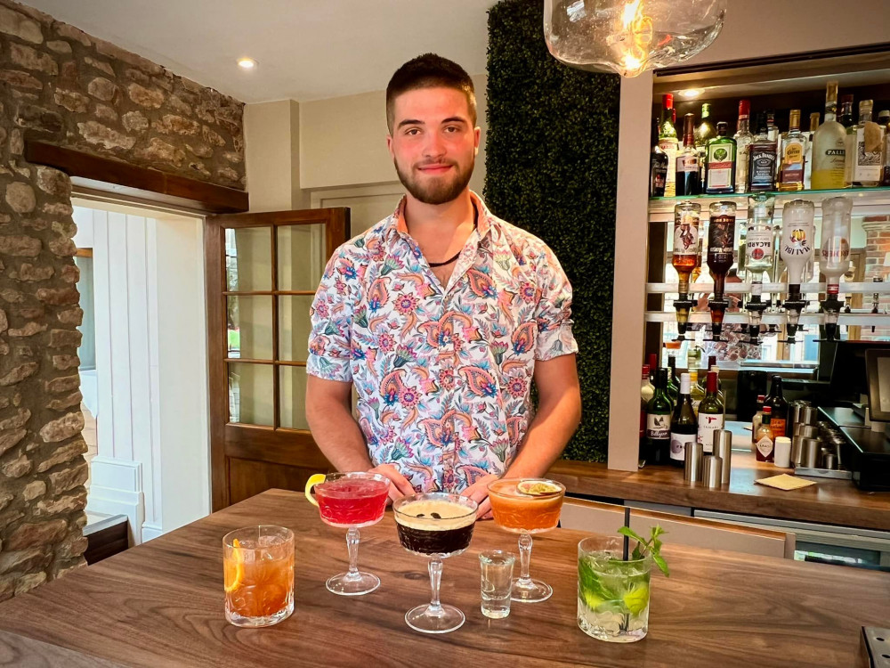 Oli with the new cocktails on the menu