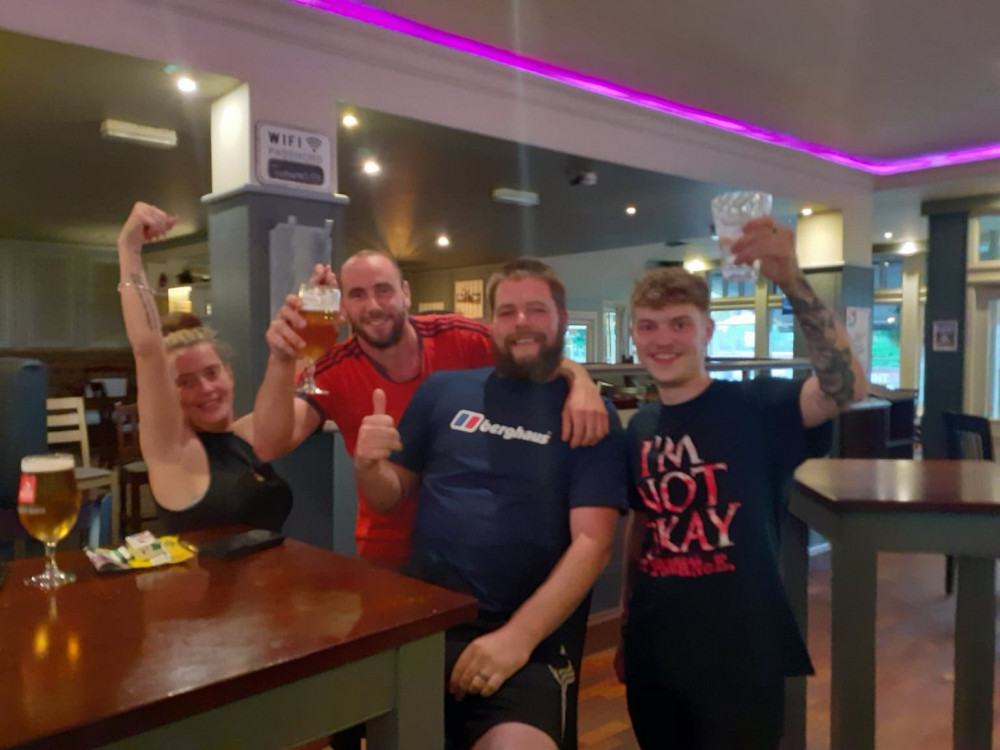 The Bank Corner supervisor, Annmarie Coyne, with football fans at yesterday's showing of the big match. 