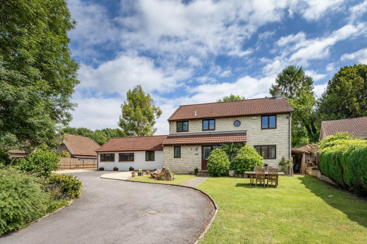 The home shares the driveway with a neighbour where there is room for up to five cars