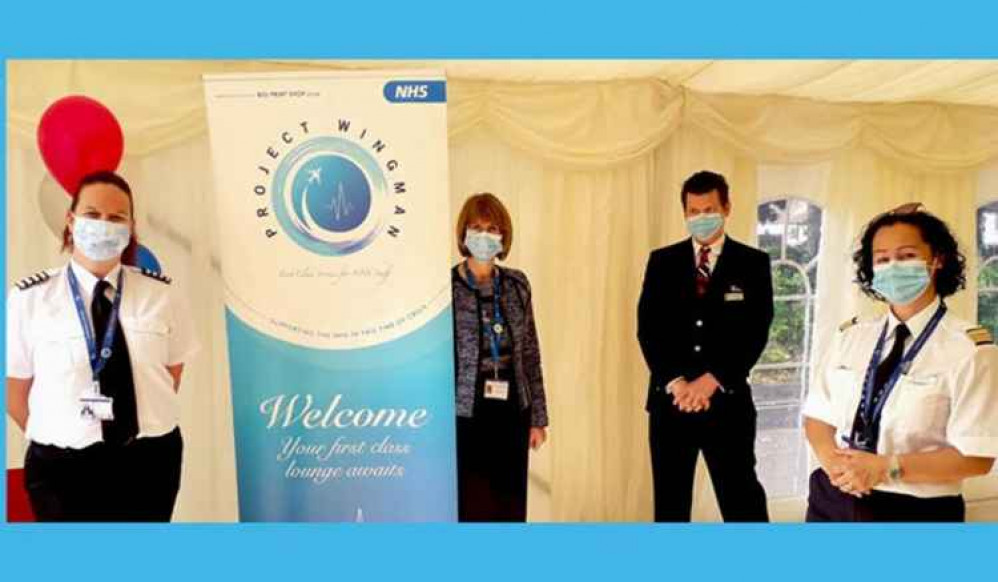 Ro Vaughan, Director of Human Resources (centre), with airline crew in the 'first class lounge' at UHNM