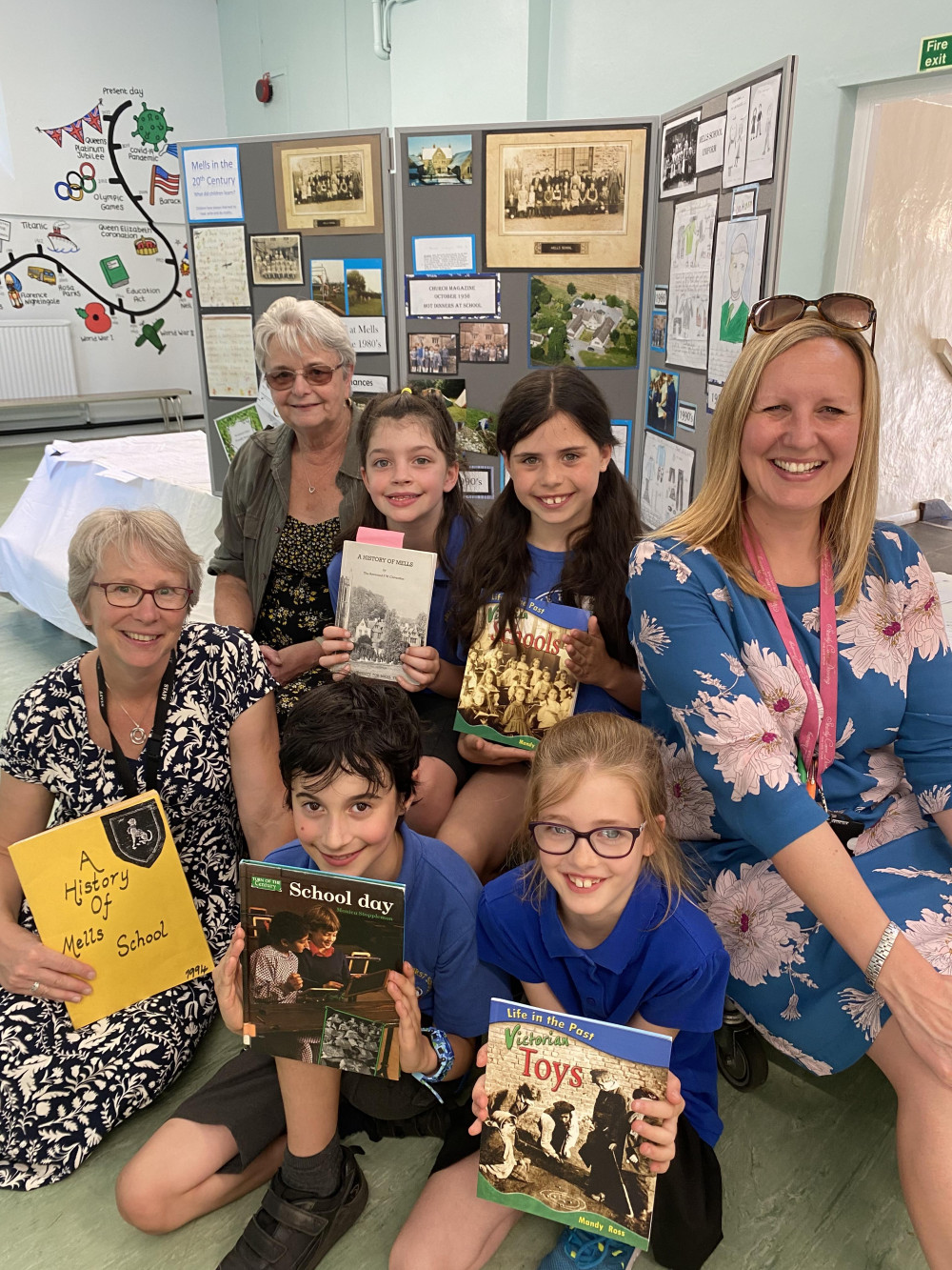 The history exhibition at Mells First School.  From left to right, Claire Chantler, Executive Headteacher, Jan Seewooruttun, Mells First School pupils and Kate Simons, Senior Teacher.