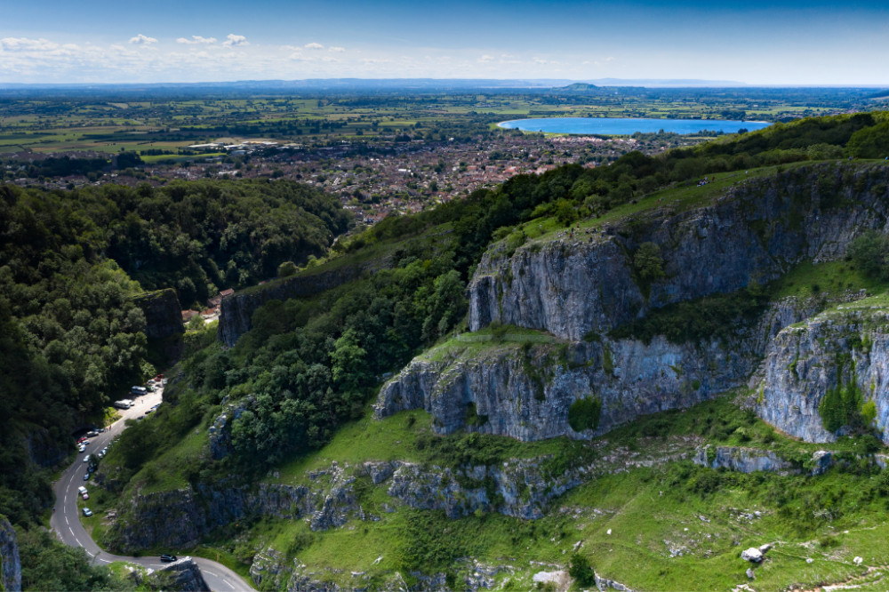 A landscape view of Cheddar with the Somerset Levels in the distance A landscape view of Cheddar with the Somerset Levels in the distance