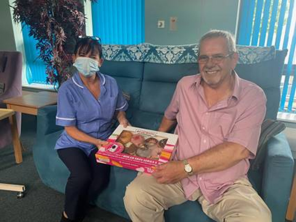 St Luke’s Hospice nurse Gail Phillips with Tony Paddon, who brought in treats for staff on his 75th birthday