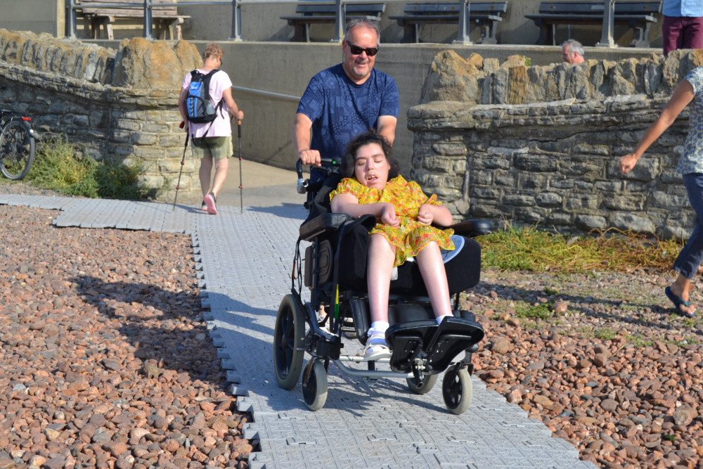 Neil and his daughter Lucy on the beach at West Bay