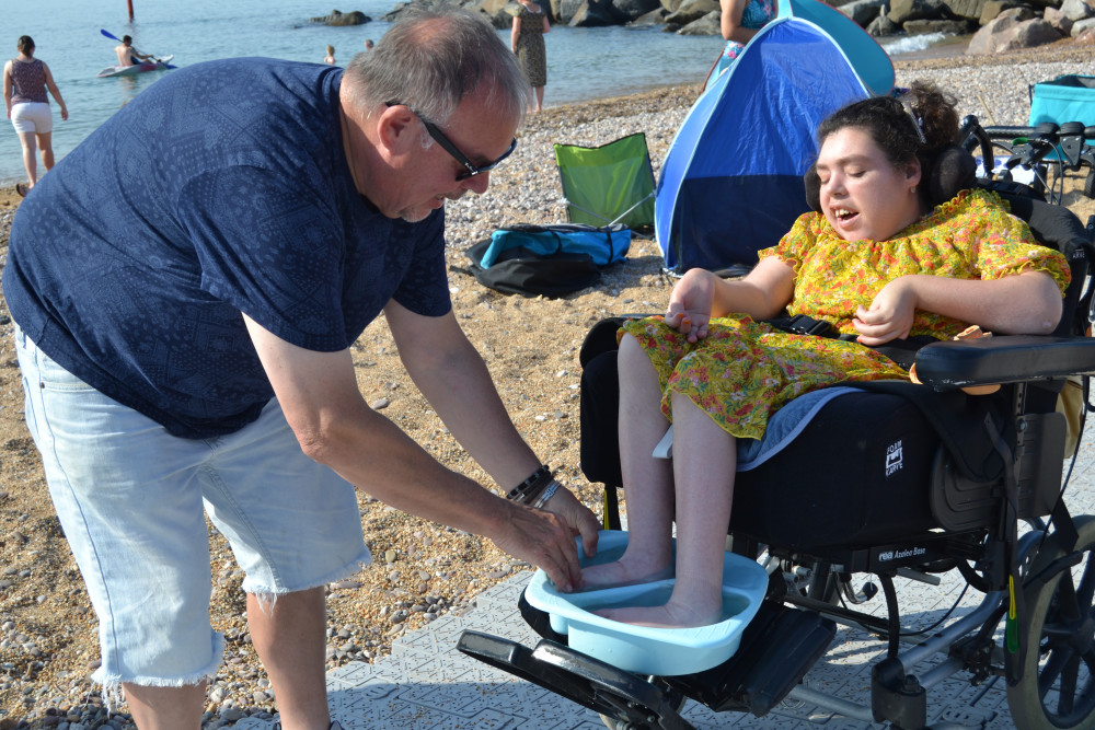 Neil and his daughter Lucy on the beach at West Bay