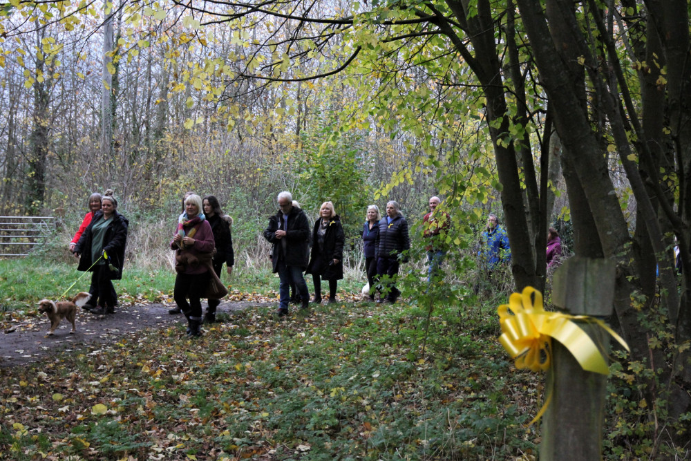 HAWFD group on a walk together through Dob Park wearing yellow ribbons to show their opposition to the planned development on Whyburn Farm. Photo courtesy of HAWFD.