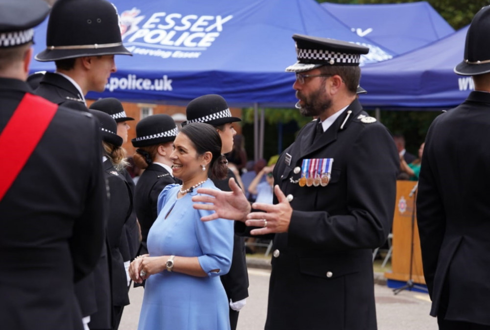 Deputy Chief Constable Andy Prophet and Home Secretary Priti Patel talking to officers at the parade