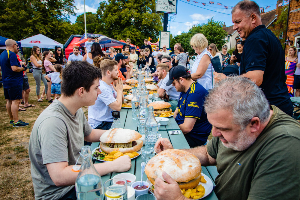 YouTuber downs 4lb burger – with sides – to win county contest. CREDIT: Danny Loo/StrandPR