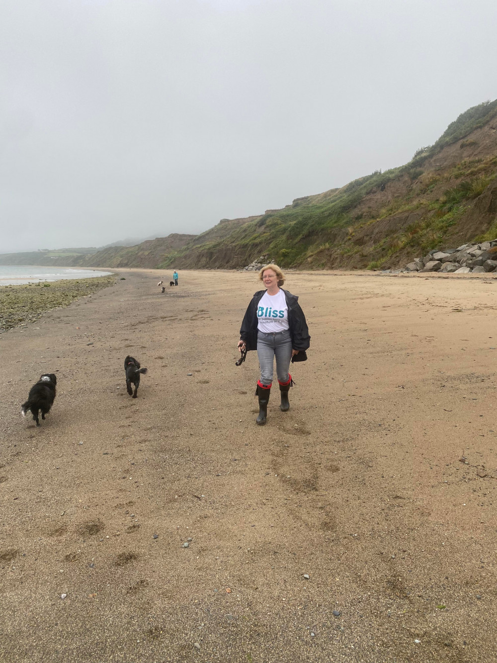 Chris Price-Jones with Ruby and Zola on one of their long coastal walks for the challenge 