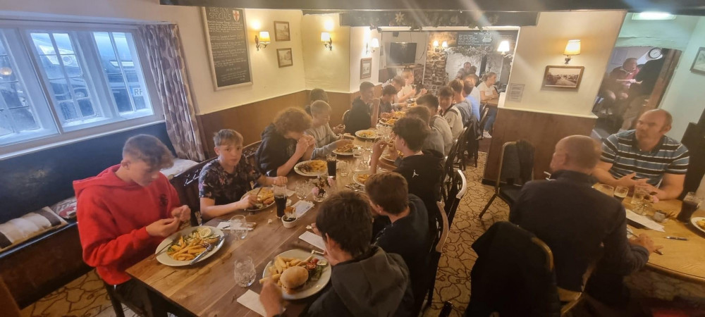 Axminster Two Under 15s tucking into their pre-season celebration at the York Inn Axminster Two Under 15s tucking into their pre-season celebration at the York Inn