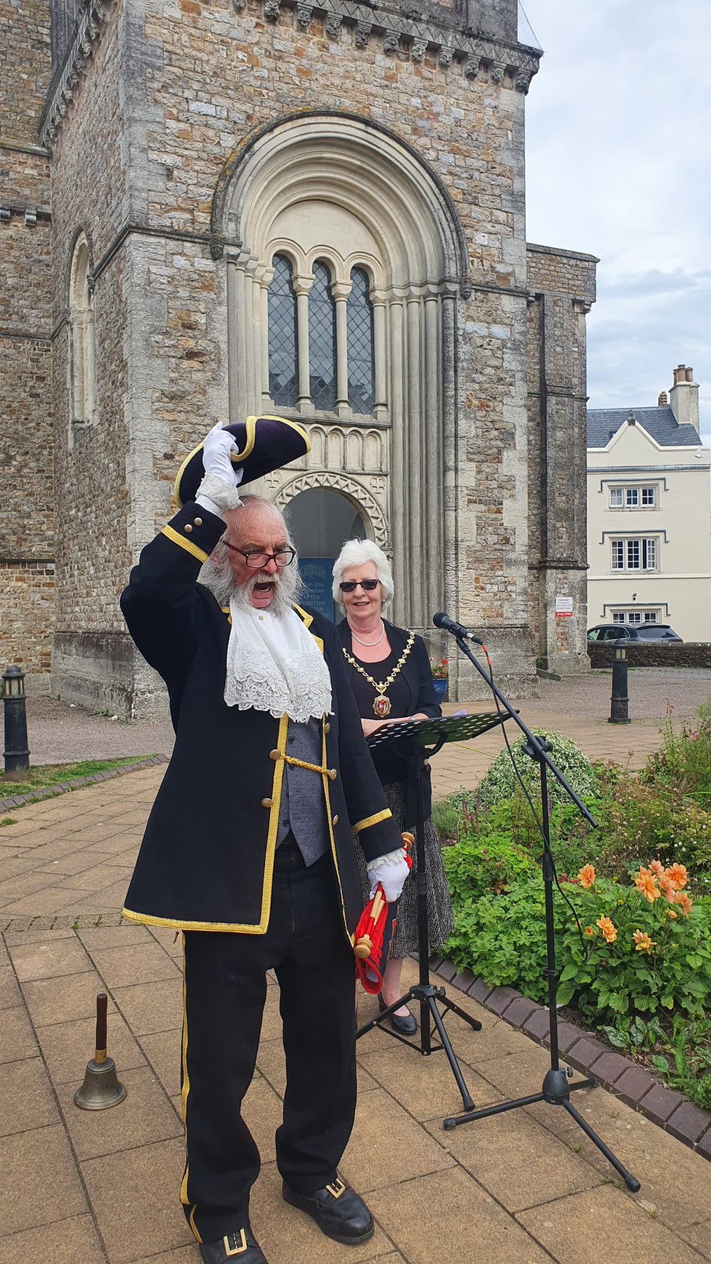 Town Crier Dave Retter leads three chants of 'God Save the King'