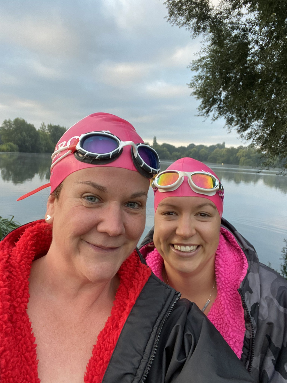 Anne Renshaw with fellow swimmer Marit fundraising for the Friends of Teddington Memorial Hospital