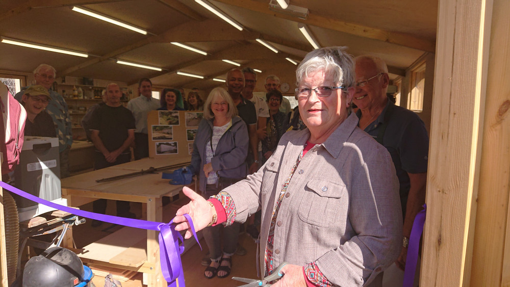 Gayle Chapple cuts the ribbon at the new workshop