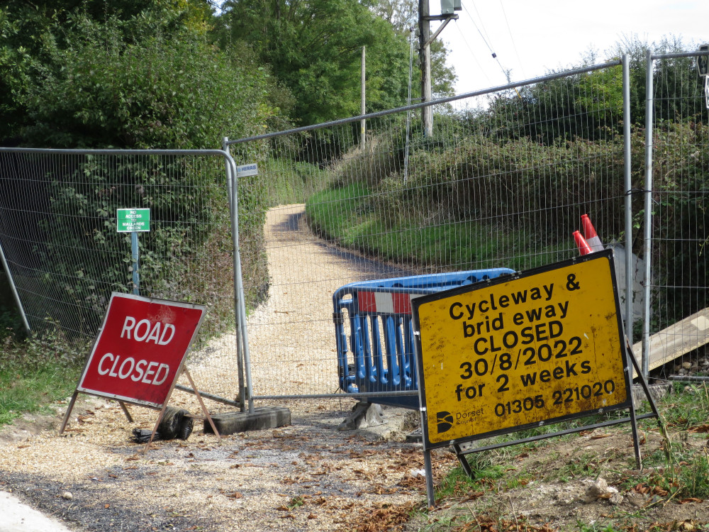 Section of the closed cycle path at its western end in Martinstown, opposite Bats Lane.