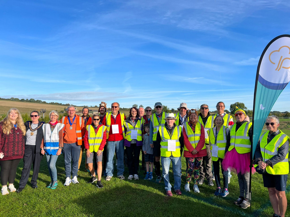 The Mayor of Axminster, Cllr Jill Farrow, and Devon County Council chair Ian Hall with the volunteer team, including Harry Le Masurier, the pioneer junior parkrunner who helped develop the course in trial events this summer