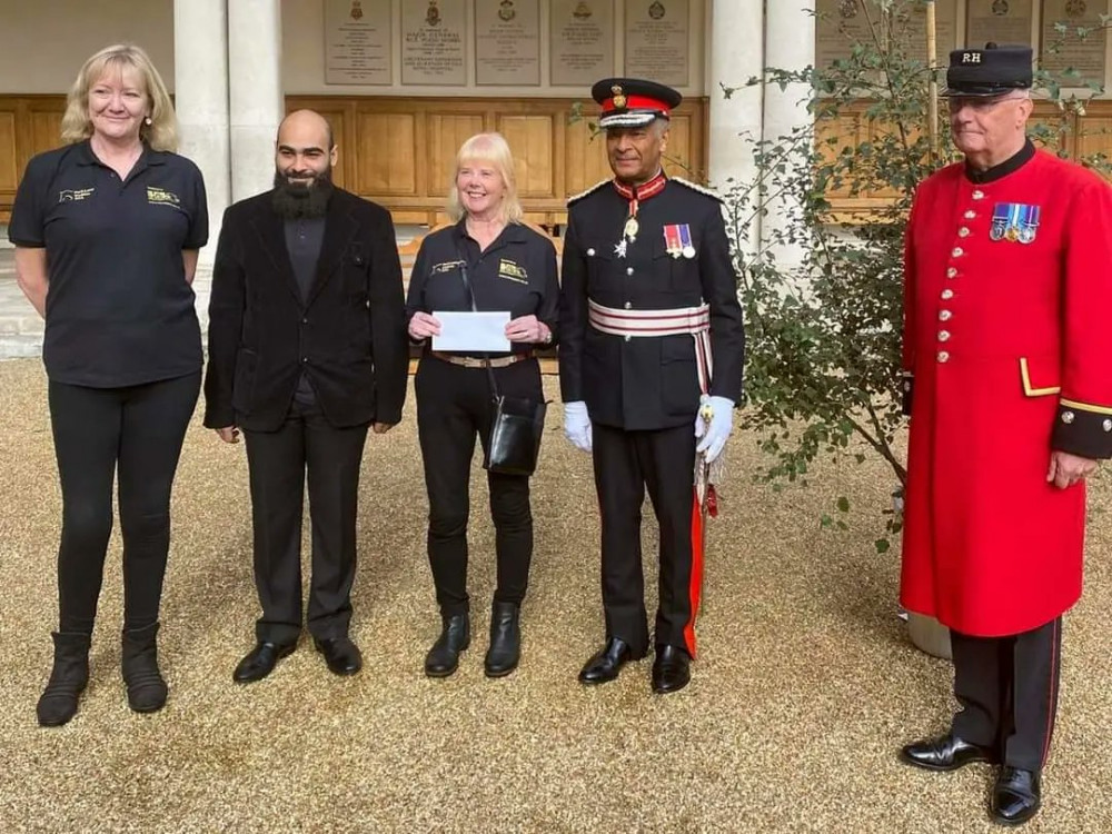 Left to right: Sarah Meagher, Mahmoud AlNaffakh and Cathy Cooper of Park Lane Stables, Sir Kenneth Olisa, Lord-Lieutenant of Greater London and a Chelsea pensioner who took part in the ceremony (Image: Sarah Meagher).     