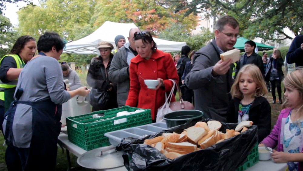 The community comes together to share some collective soup and enjoy free live music and entertainment