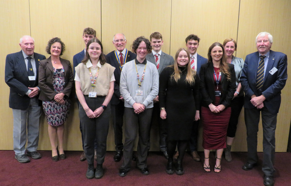 The young scholars photographed with members of Rotary Club of Warwick (image supplied)