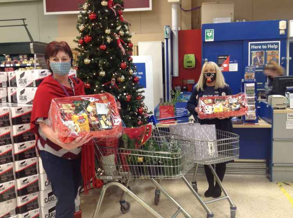 Home Instead collect Christmas hampers from a local supermarket Home Instead collect Christmas hampers from a local supermarket
