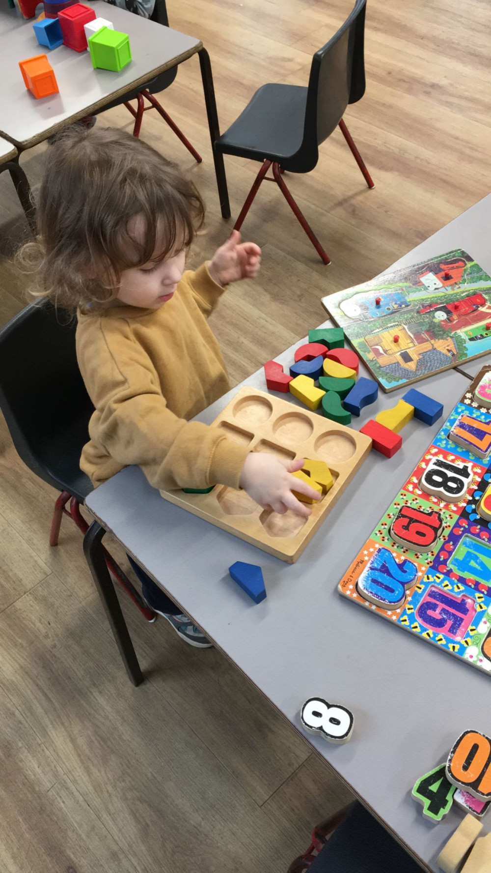 Child enjoys playing with puzzles Child enjoys playing with puzzles