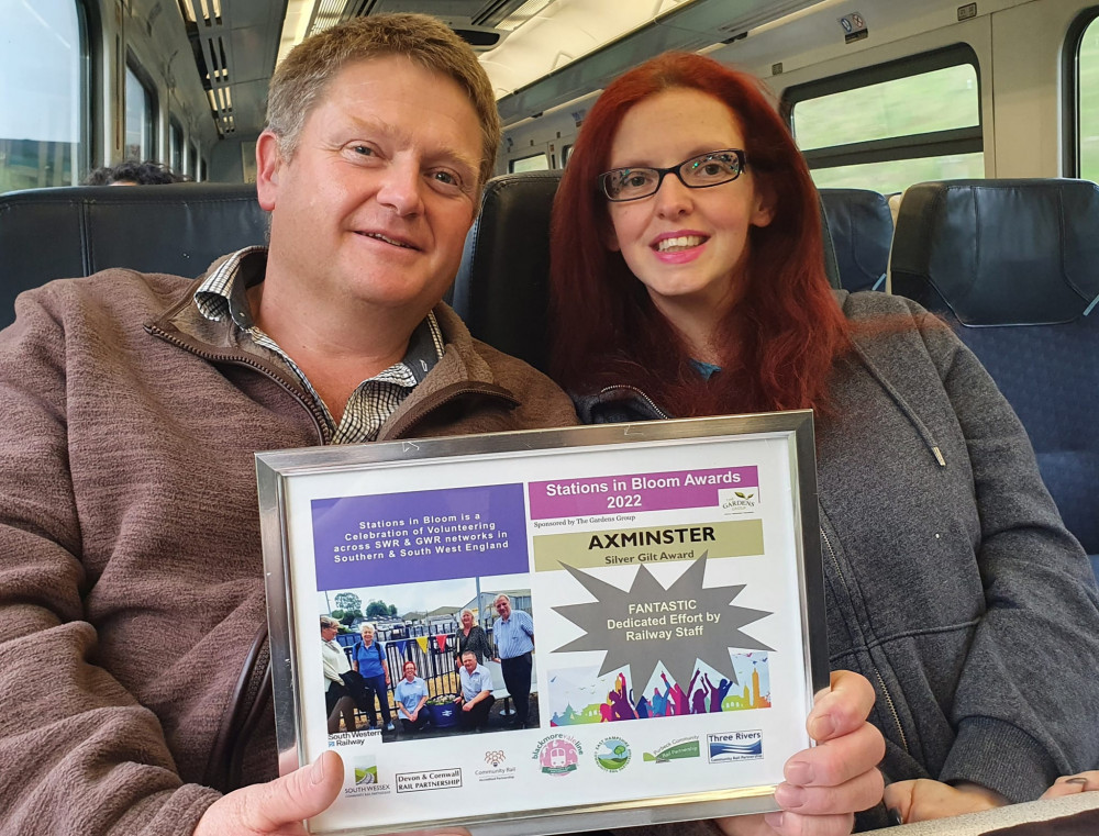 Leanne Watterson and Alexander Spry, station managers at Axminster railway station, with their certificate