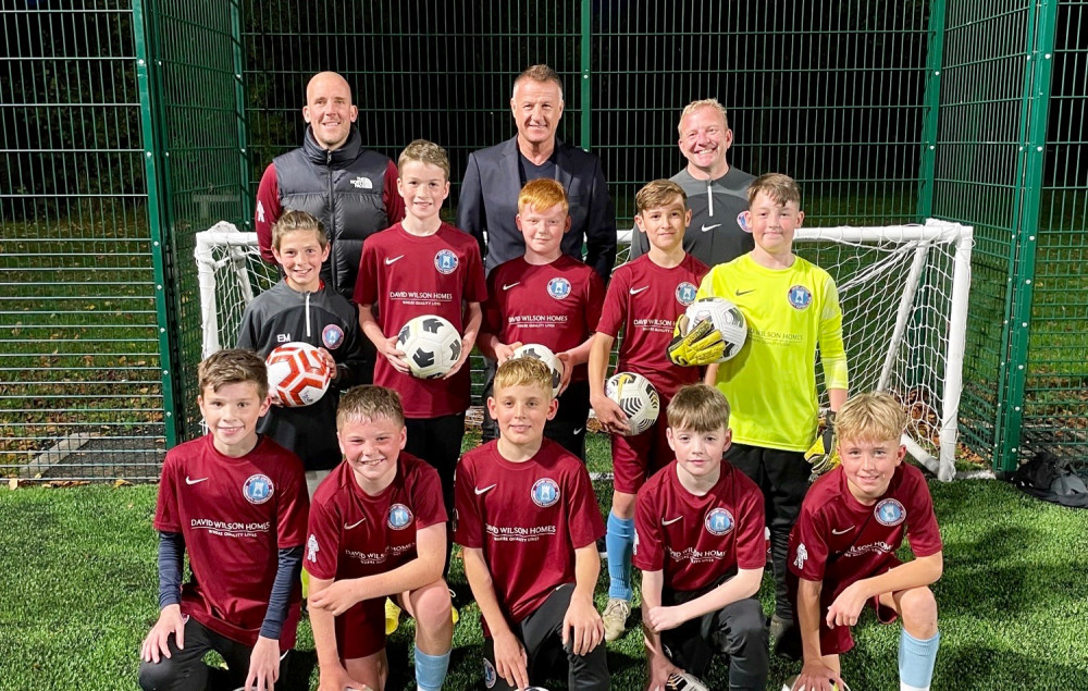 Former Leicester City star Steve Walsh (back, centre) with junior members of Ashby United Community Football Club