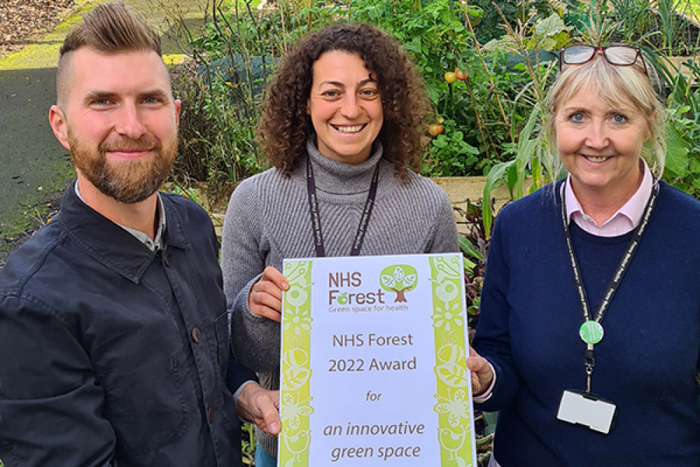 Gareth Hannam, Charlotte Carson and Julie Carey-Downs from Frome Medical Practice celebrate the NHS Forest Award