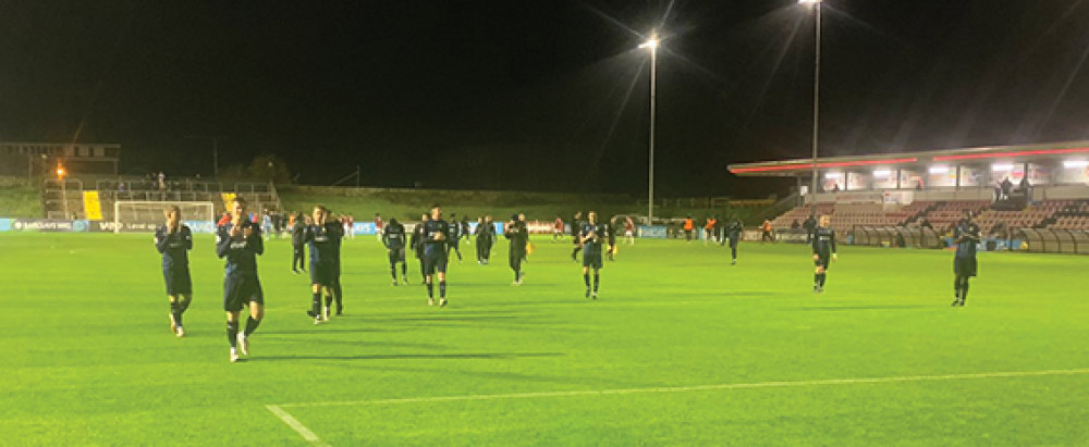 Aveley players applaud the travelling fans at the Dripping Pan