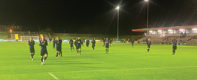 Aveley players applaud the travelling fans at the Dripping Pan