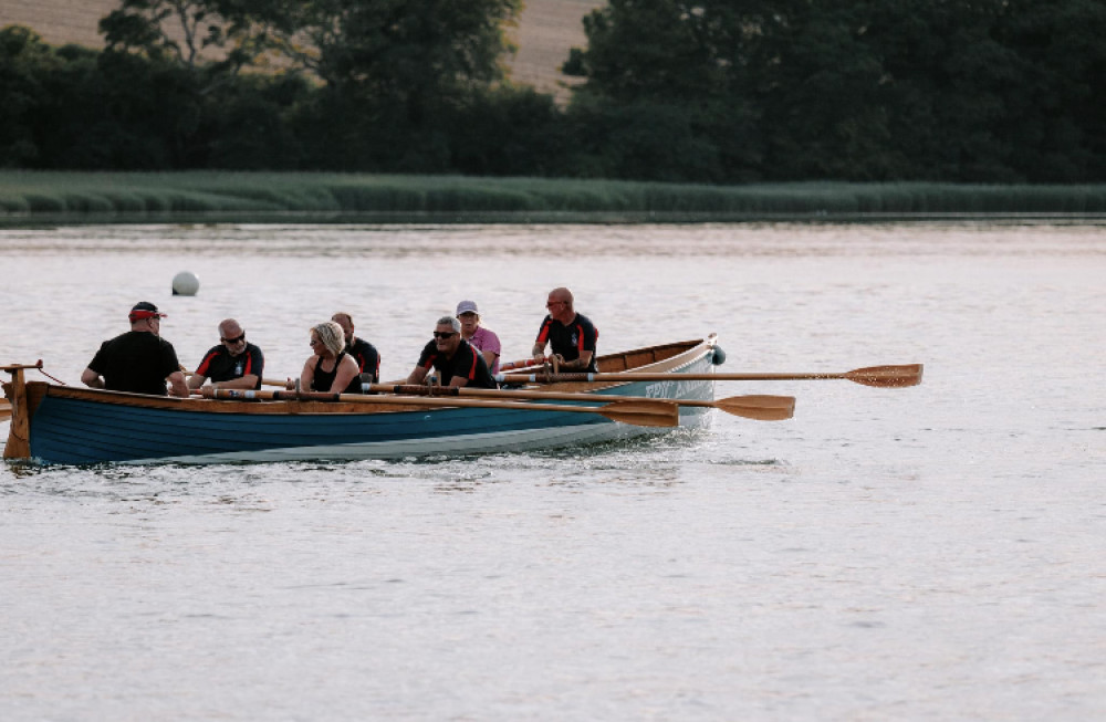 The mixed crew heading across the finish line at Devoran Quay (Image provided by EPIC GIGability).