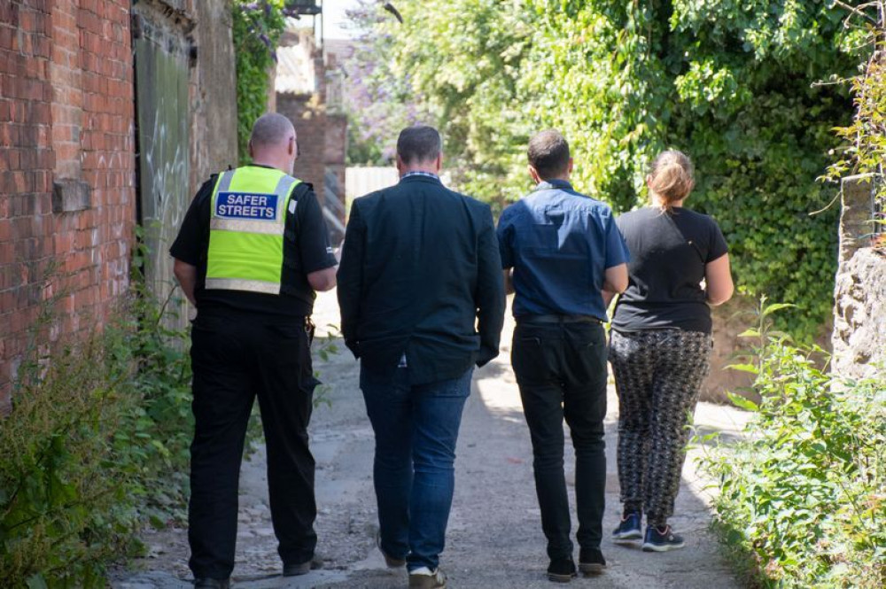 Councillors and police staff walking down 'mucky alley' in Ashfield. Photo Credit: ADC.