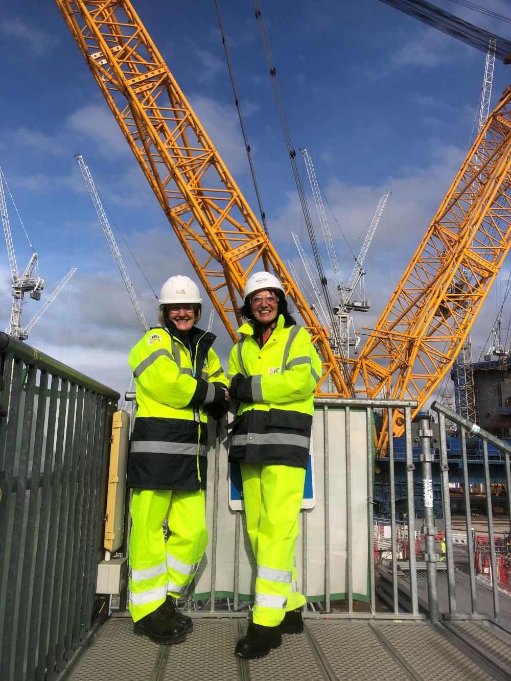 Shevaun Haviland (left), Director General of the British Chambers of Commerce and Emma Rawlings, Chief Executive of Somerset Chamber of Commerce pictured with the world’s largest crane, Big Carl, at Hinkley Point C.