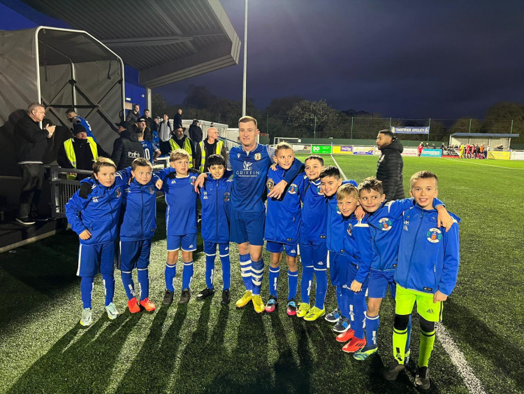 Sam Bantick was today's man of the match for grays and is pictured with the mascots. 