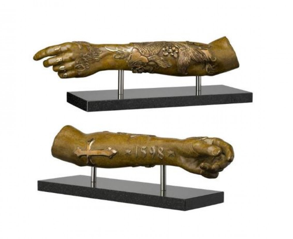 The bronze sculpture, Modern Relic Arm (Japanese Koi) by Dan Lane