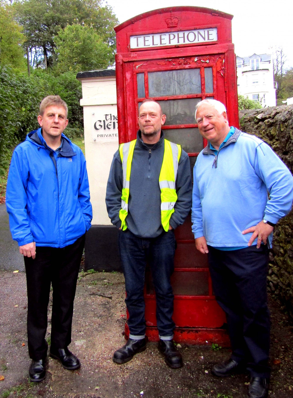 Paul Johns and Phil Tuckley of Seaton Town Council, with Simon Wellington pictured outside the Seaton Hole telephone box