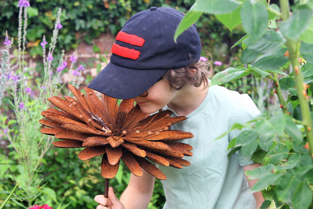 Young Aidan taking in the sights and smells at an open garden (Photo credit: Jill Pendleton)