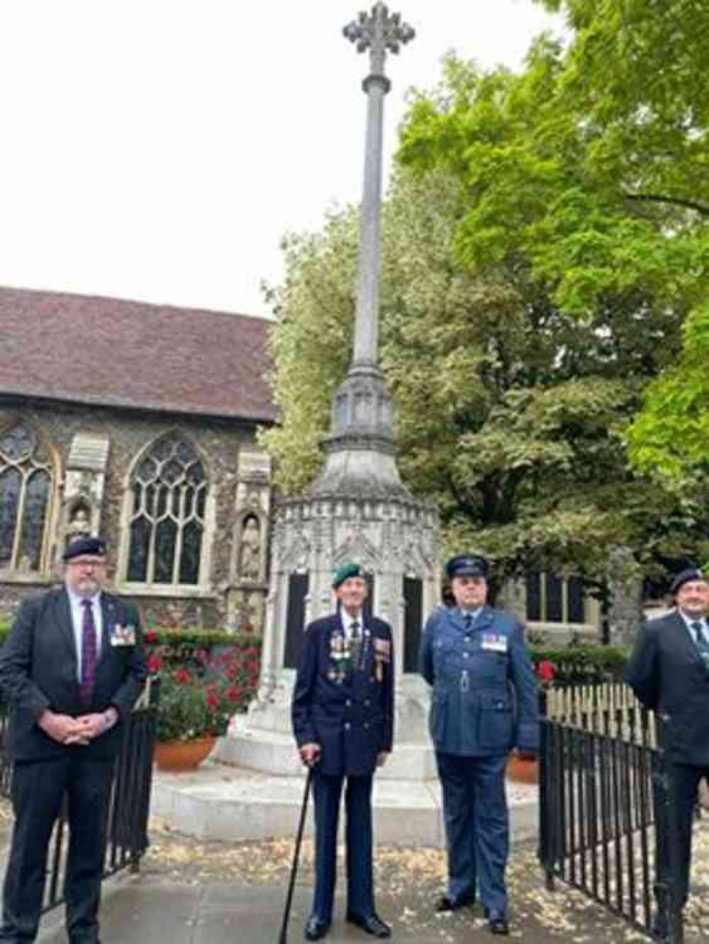 Maldon's Royal British Legion chairman, veteran Ron Baker (centre) lays flowers at the town's war memorial