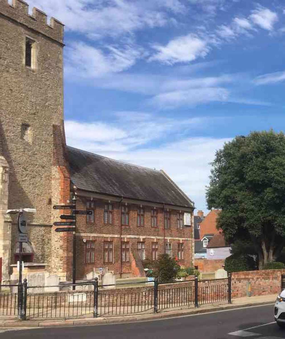 The building attached to the tower of the medieval church of St Peter: the upper section of the building houses the library