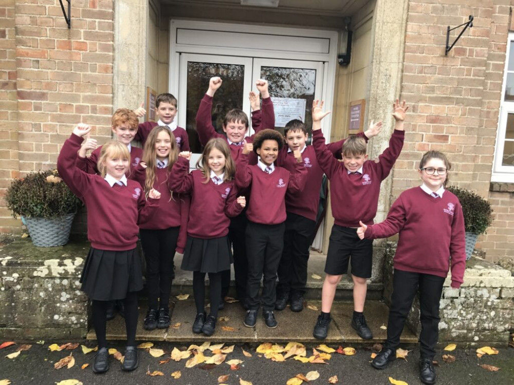 Children from Year Five at Oakfield celebrate their achievement.