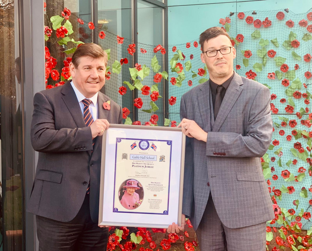 Stephen Metcalfe, left, took the opportunity of his visit to present Gable hall with a Platinum Jubilee certificate and is pictured handing it to Gary Lewis.