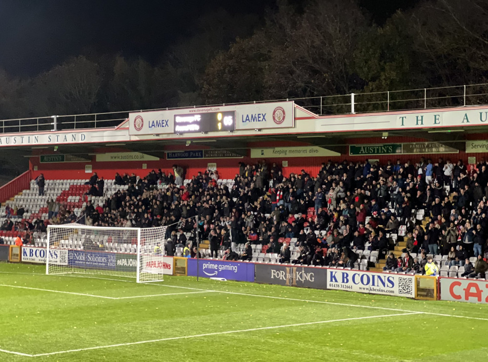 Player Ratings: Stevenage - Arsenal U21s. PICTURE: The travelling Arsenal support celebrate moment after Nathan Butler-Oyedeji's early goal. CREDIT: @laythy29 